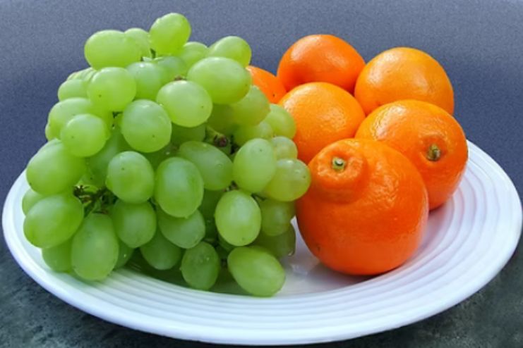 orange, grapes and pomogranite