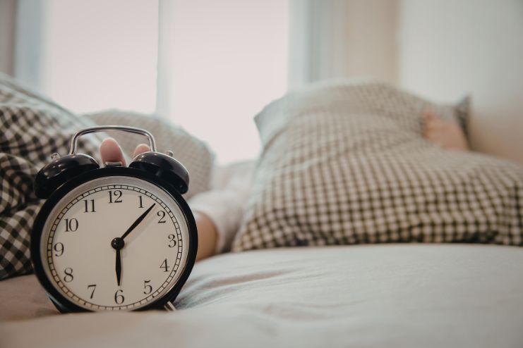 Try to sleep and wake at consistent times